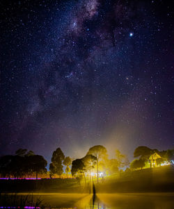 Scenic view of star field against sky at night