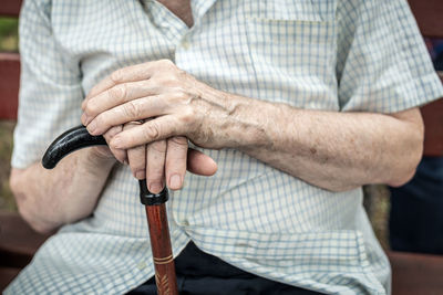 Midsection of man holding hands