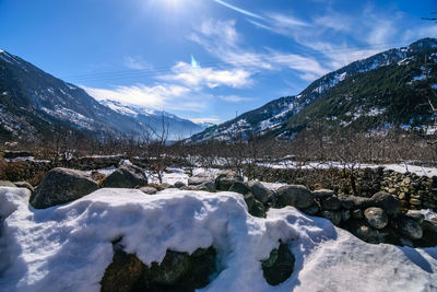 Scenic view of snowcapped mountains against sky