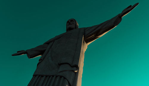 Low angle view of statue against clear blue sky