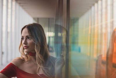 Portrait of a young woman looking away