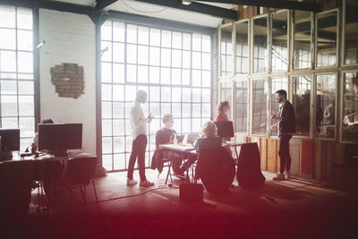 Computer professionals brainstorming over new it projects in board room at conference table