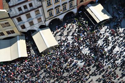 High angle view of crowd on city street by building