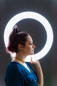 Portrait of a young woman looking away