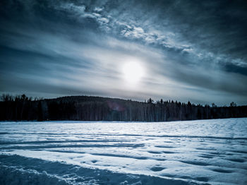 Scenic view of snowcapped landscape against sky during winter