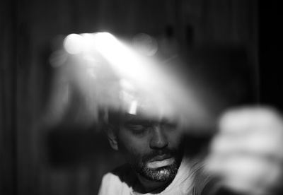 Close-up portrait of young man looking away