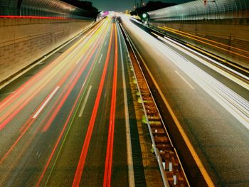 High angle view of light trails on road at night