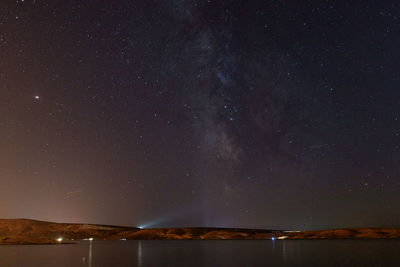 Scenic view of star field against sky at night