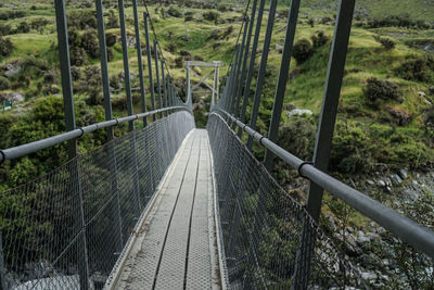 High angle view of footbridge in forest