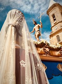 Low angle view of statue against building