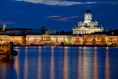 Reflection of illuminated buildings in water at night