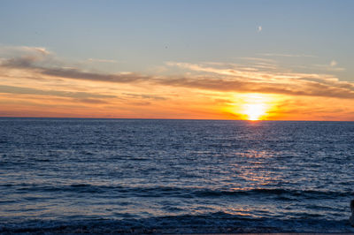 Scenic view of sea against sky at sunset