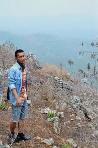 Young man standing on land