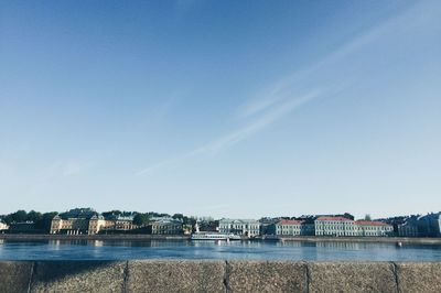 Scenic view of river against clear blue sky