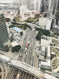 Aerial view of road amidst buildings in city