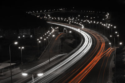 Light trails on road in city at night