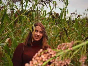 Portrait of smiling young woman on field