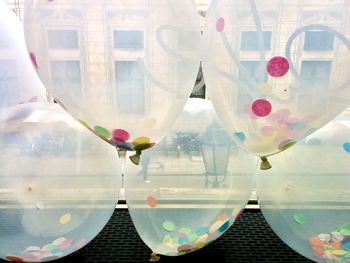 Reflection of balloons on glass window
