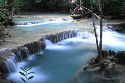 Scenic view of river flowing through rocks