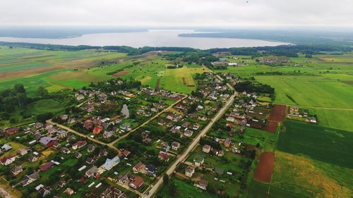 High angle view of agricultural field against cloudy sky