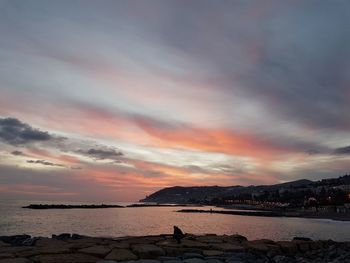 Scenic view of sea against sky at sunset