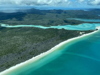 Aerial view of landscape and sea against sky