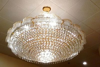 Low angle view of chandelier hanging from ceiling