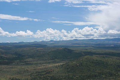 Scenic view of mountains against cloudy sky