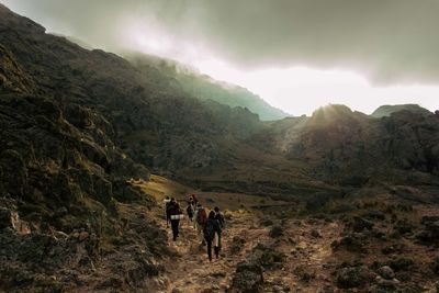 Scenic view of mountains against cloudy sky