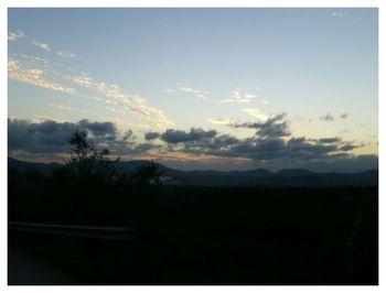 Scenic view of landscape against sky during sunset