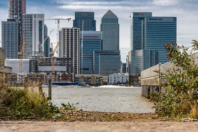 Buildings in city against sky