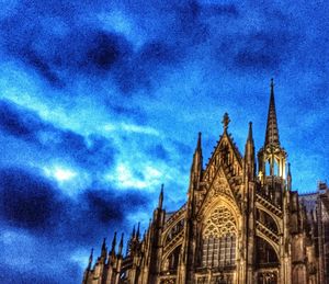 Low angle view of church against blue sky