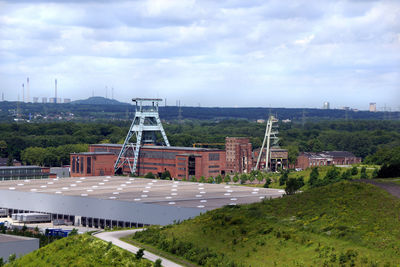 High angle view of historical coalmine buildings against sky