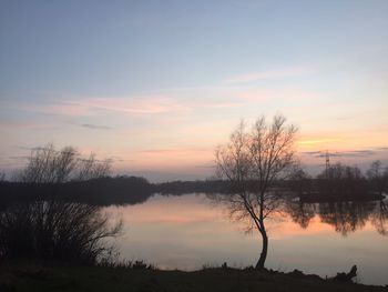 Scenic view of lake at sunset