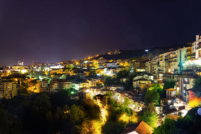 High angle view of illuminated buildings in city at night