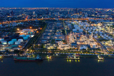 High angle view of illuminated buildings at waterfront