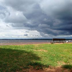 Scenic view of landscape against cloudy sky