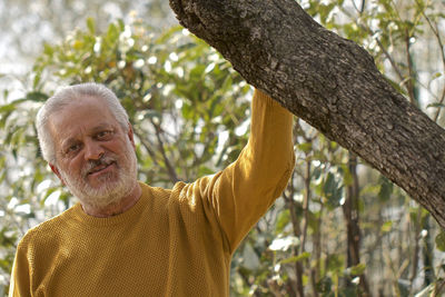 Portrait of man on tree