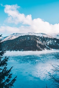 Scenic view of mountain against cloudy sky