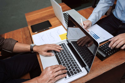 High angle view of man using laptop