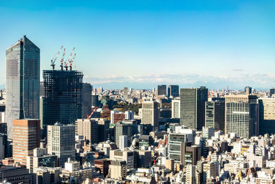 Modern buildings in city against sky