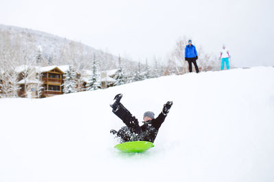 People on snow covered land