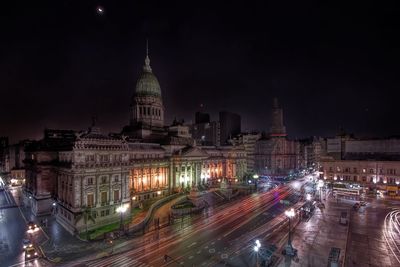 Light trails by national congress of argentina in city at night