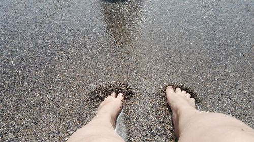 Low section of woman on beach