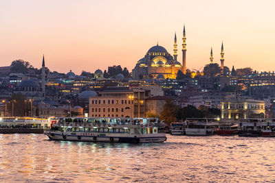 Lit up mosque in istanbul at sunset in october