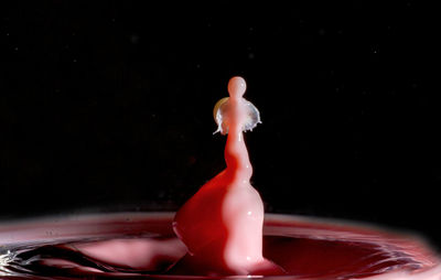 Close-up of water splashing against black background