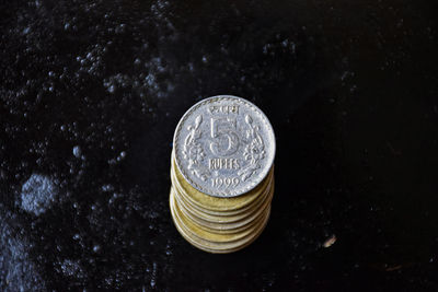 High angle view of coins on table