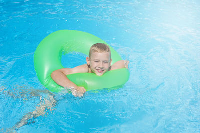 Portrait of smiling girl in swimming pool