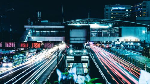 High angle view of light trails on road at night