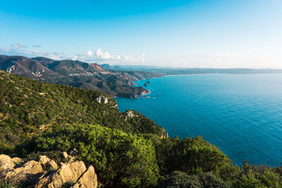 Wide shot of the beautiful coast and sea stacks of sulcis iglesiente, in sardinia, italy